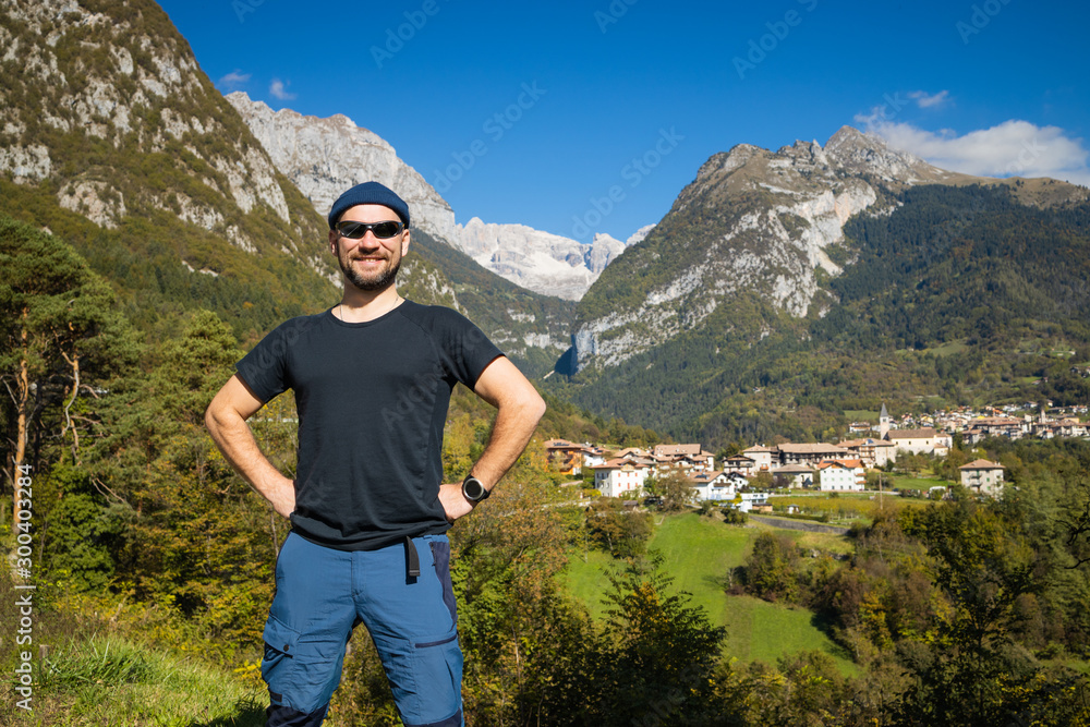 happy man on the background of a beautiful alpine landscape