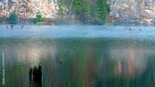 Morning with fog on the edge of Red Lake or Lacu Rosu in Romania.