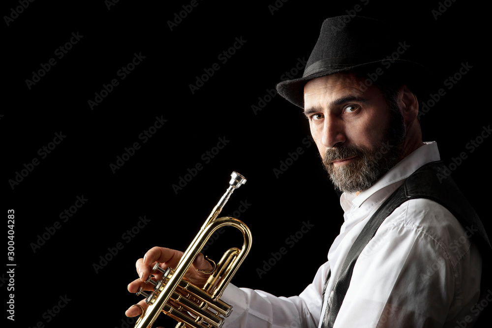 Obraz premium trumpet man with beard portrait on black