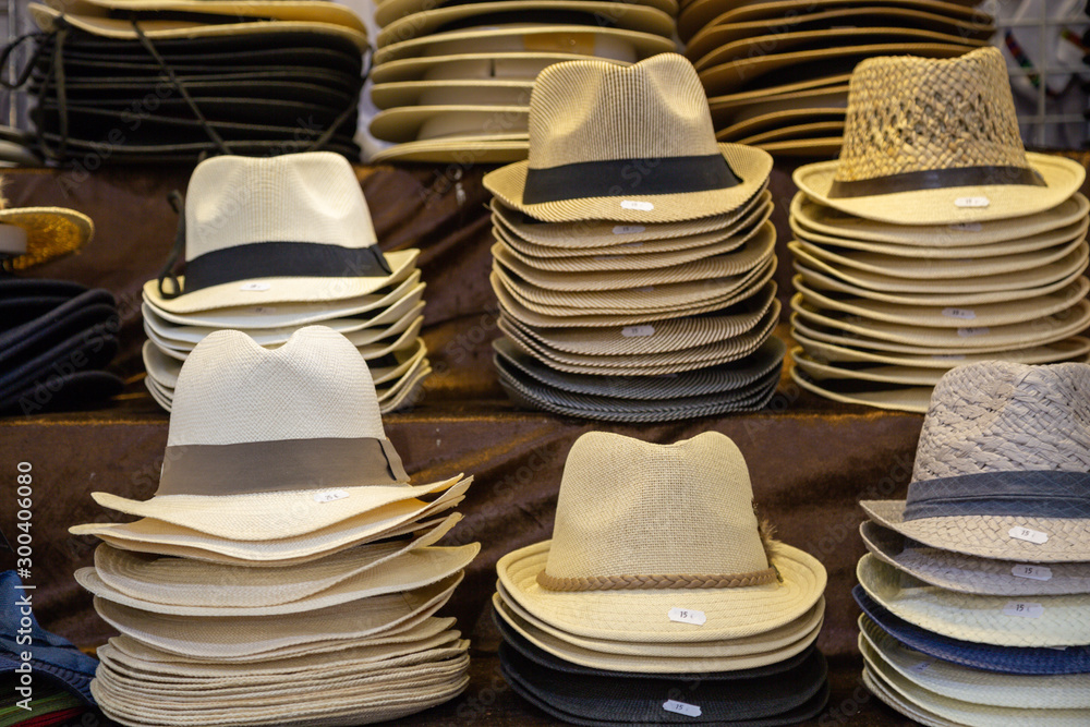 assortment of genuine hand-made panama hat on a shelf