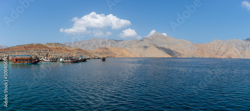 Panorama View from Dhow Boat to spectacular rocky mountains of northern Oman in Musandam in the fjords.