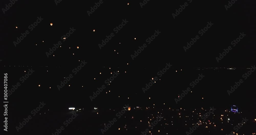 Floating lanterns illuminated night sky, wide Floating lanterns illuminated night sky, wide