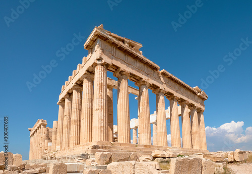 Parthenon temple on a bright day with blue sky. Classical ancient Greek civilization landmark, famous place, panorama travel background.Panoramic image taken in Acropolis hill in Athens, Greece.