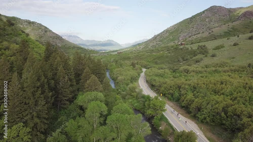 Wide aerial, people run marathon through rural Utah landscape Wide aerial, people run marathon through rural Utah landscape