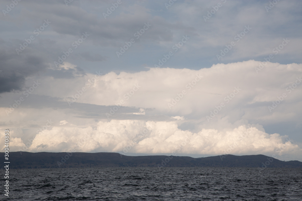 Panoramic view of the Titicaca lake in a cloudy day in  Puno, Peru