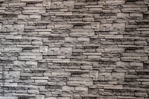 Gray brick wall overlapping into layers.