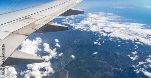 Ryanair flying and traveling, view from airplane window on the wing.