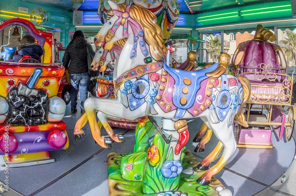 Fototapeta premium Colorful carousel at the amusement park