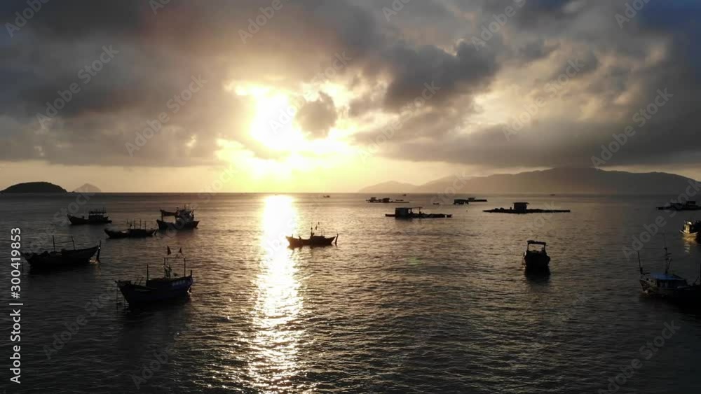 Drone shoots video of fisherman boat sunset and mountain view Drone shoots video of fisherman boat sunset and mountain view