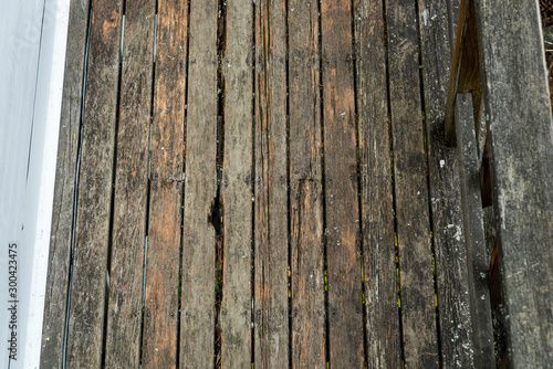 View from above, weathered and rotted wood deck in need of replacement photo