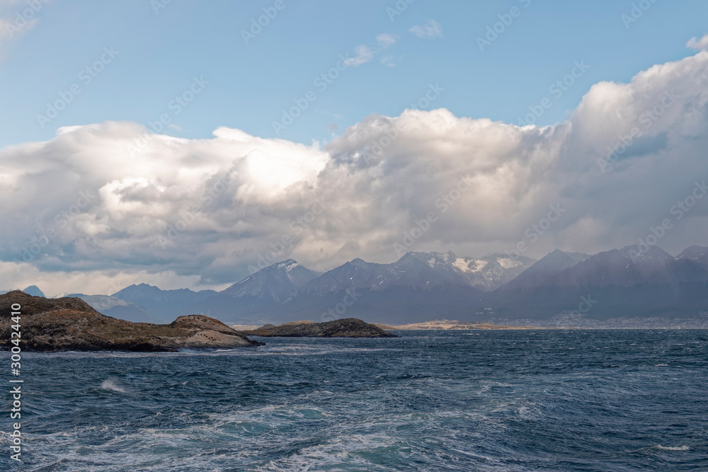 Argentina, Patagonia – oceanic island against the backdrop of mountain peaks.