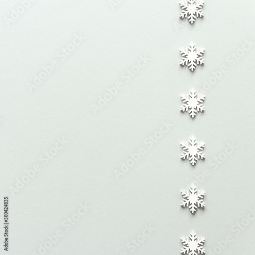 Christmas composition. White snowflake top view background with copy space for your text. Flat lay.