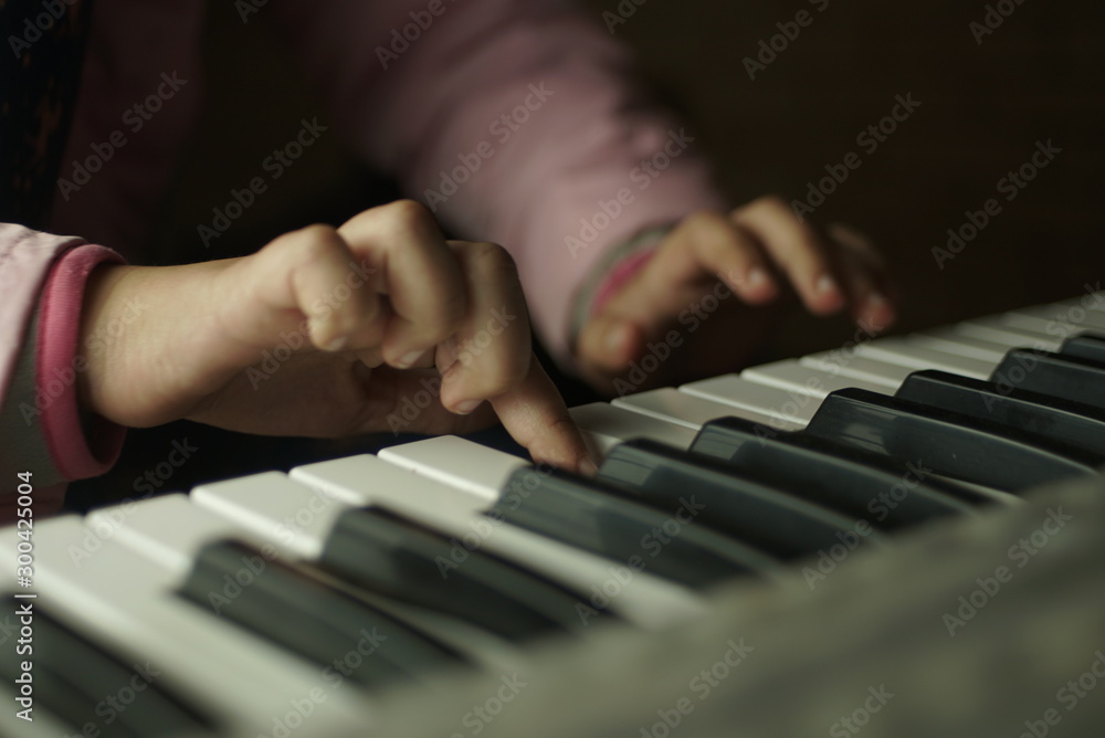 children's hands are playing the piano children's hands are playing the piano