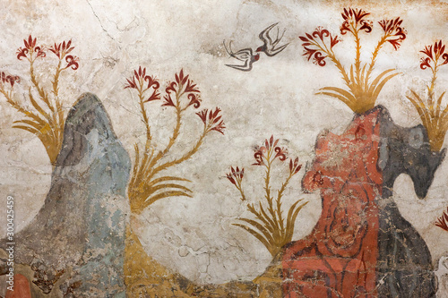 Springtime Fresco with trees, lilies flowers and swallows from palace of Minoan Settlement at Akrotiri on Santorini island, Cyclades, Greece