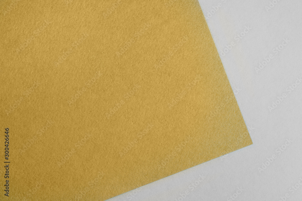 Paper background with paper texture yellow. Overlaid sheets of paper. Paper background with paper texture yellow. Overlaid sheets of paper.
