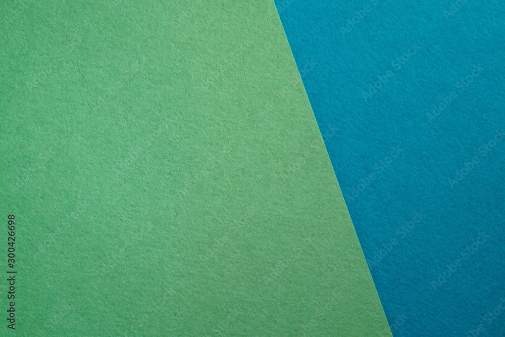 Fototapeta premium Paper background with paper texture in different colors. Overlaid sheets of paper.