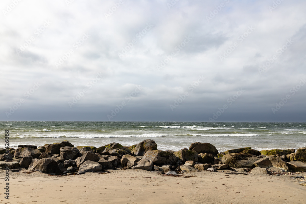 Waves and rocks at Bertra beach in cloudy day Waves and rocks at Bertra beach in cloudy day