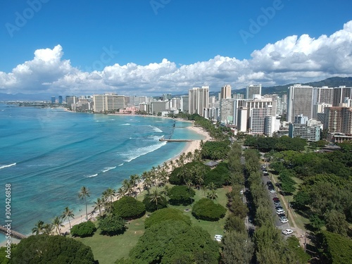 Panorama drone aerial view of Waikiki beach Honolulu Hawaii USA turquoise waters white golden sandy beach resorts along the shore 