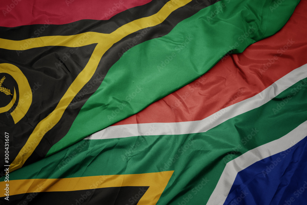 Obraz premium waving colorful flag of south africa and national flag of Vanuatu .