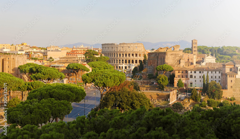 Panoramic view of Rome. Cityscape skyline of landmarks of Ancient Rome: Coliseum and Roman Forum famous travel destinations of Italy.