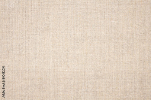 Natural canvas background. Light beige cloth texture.