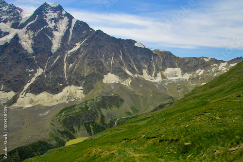 Multicolored lake between mountains of Northern Caucasus