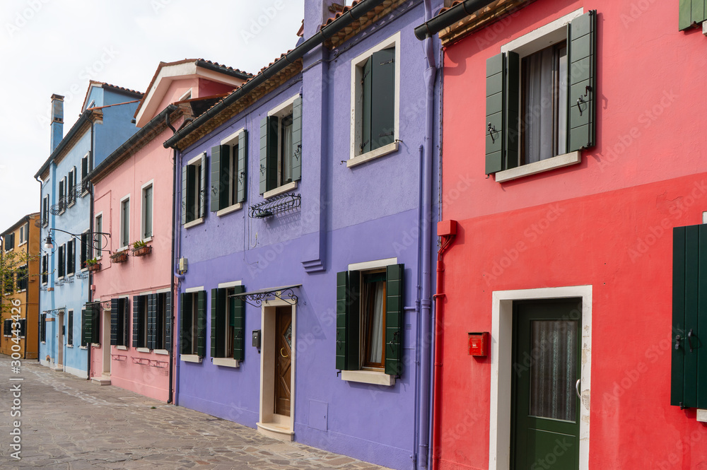Venice, Italy. Colorful houses in Burano island. Street view. Travel photo. Europe. Venice, Italy. Colorful houses in Burano island. Street view. Travel photo. Europe.