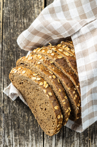 Canvas Print Sliced whole grain bread with oat flakes. Wholemeal bread.