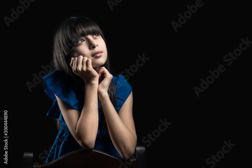 young bruenette girl daydreaming photo