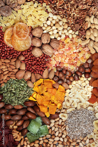 Dried fruit, seed and nut selection, health food high in antioxidants, protein, minerals, vitamins, omega 3 and anthocyanins. Flat lay.