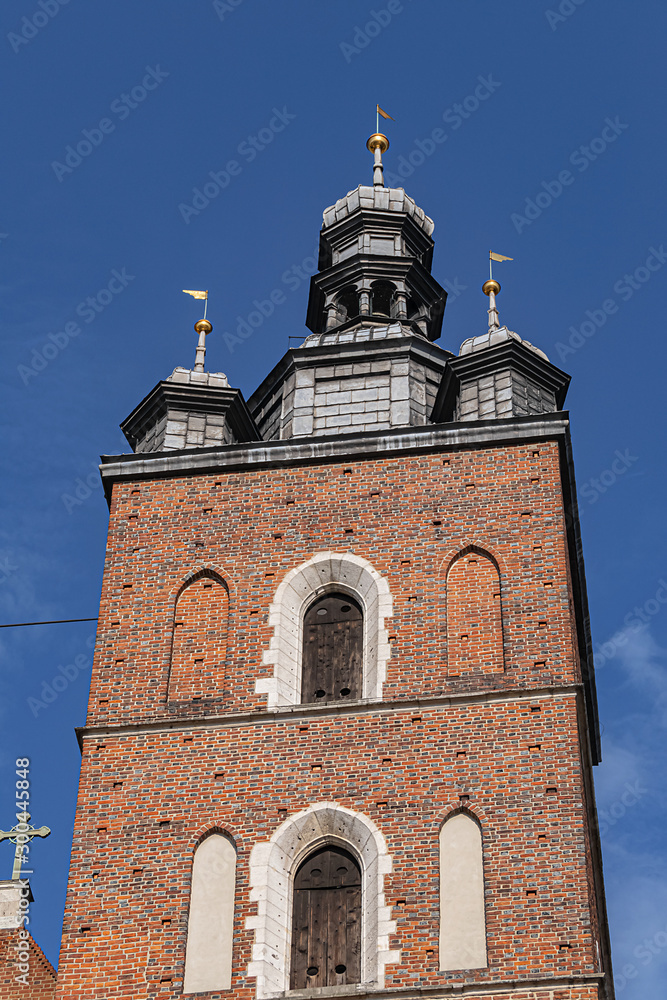 Architectural fragments of Brick Gothic St. Mary's Basilica (Church of Our Lady Assumed into Heaven or Kosciol Mariacki). Built in early XIII century Church is main landmark of city. Kracow, Poland.