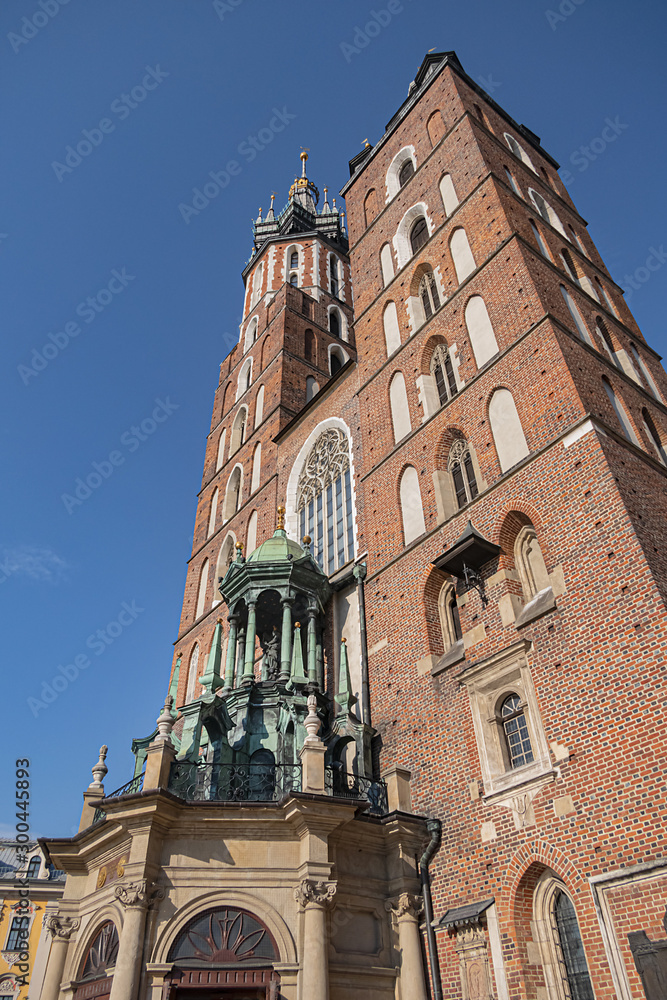 Architectural fragments of Brick Gothic St. Mary's Basilica (Church of Our Lady Assumed into Heaven or Kosciol Mariacki). Built in early XIII century Church is main landmark of city. Kracow, Poland.