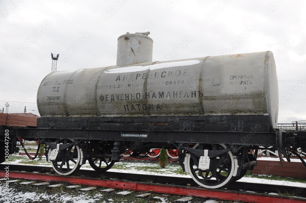 Antique steel cistern on the platform with half-erased inscriptions. Antique steel cistern on the platform with half-erased inscriptions.
