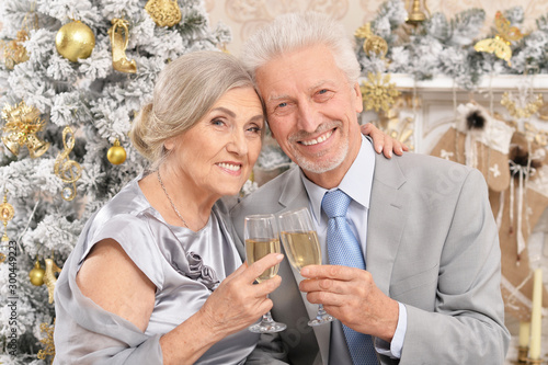 Close up portrait of old couple with Christmas present