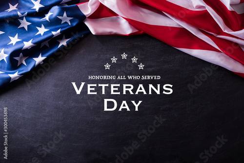 Happy Veterans Day. American flags veterans against a blackboard background. photo