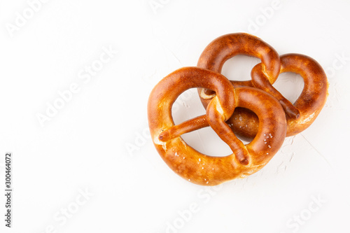 Pretzels with salt on white background top view. Copy space