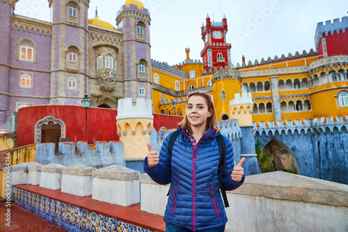 Young woman tourist walks in Pena Palace, Sintra, Portugal . Travel and tourism in Europe