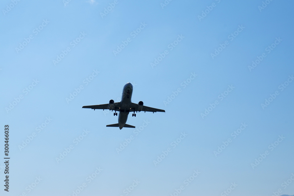 Airplane take off at airport. Passenger plane fly up over take-off runway from airport.