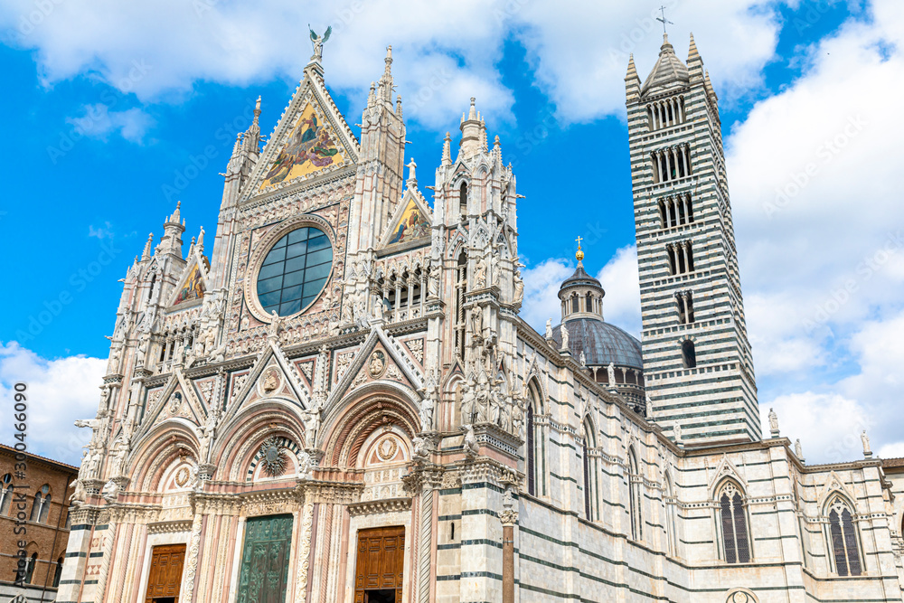 Scenery of Siena, a beautiful medieval town in Tuscany, with view of the Dome & Bell Tower of Siena Cathedral (Duomo di Siena), landmark Mangia Tower and Basilica of San Domenico,Italy