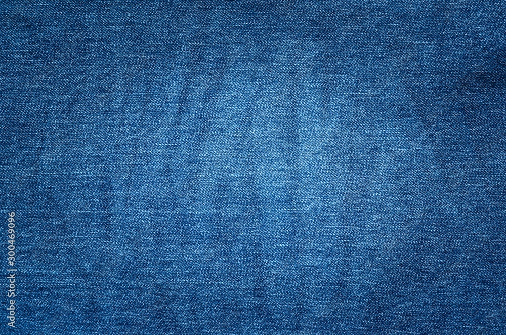 Dark fabric background. Dark blue jeans texture. Dark fabric background. Dark blue jeans texture.