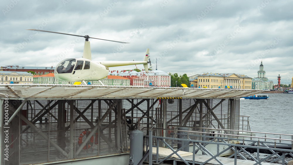 Saint-Petersburg. The helicopter landed on the roof of the water pavilion. Rivers Of St. Petersburg. Neva river on a cloudy day. Helipad on the roof of the pier. Travel to Russia.