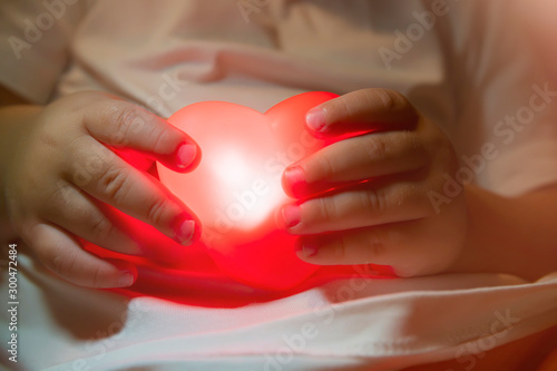  heart in the hands of a child closeup