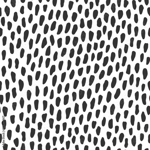 Vector hand drawn seamless dot pattern with short vertical brushstrokes.