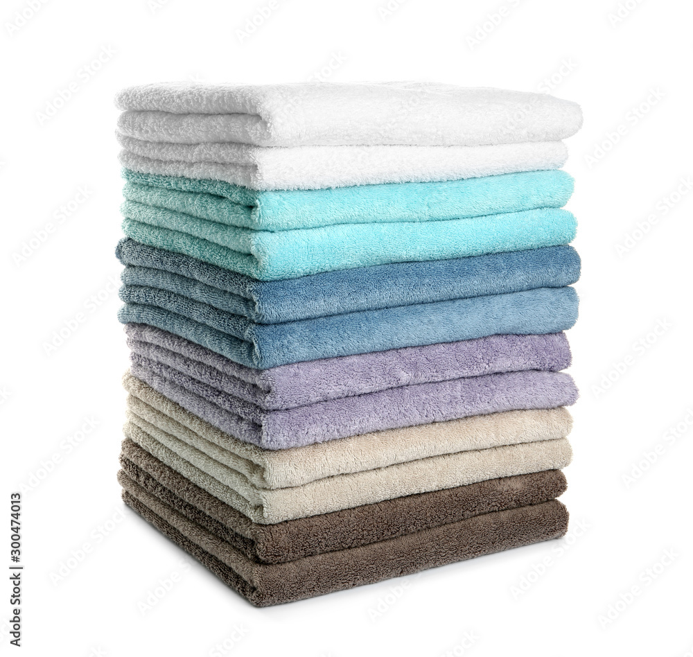 Different fresh soft terry towels on white background