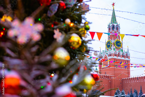 Moscow. Russia. Christmas in the capital of the Russian Federation. Red square is decorated for the New year. Waiting for the holiday. Flags, garlands and Christmas tree in front of the Kremlin.