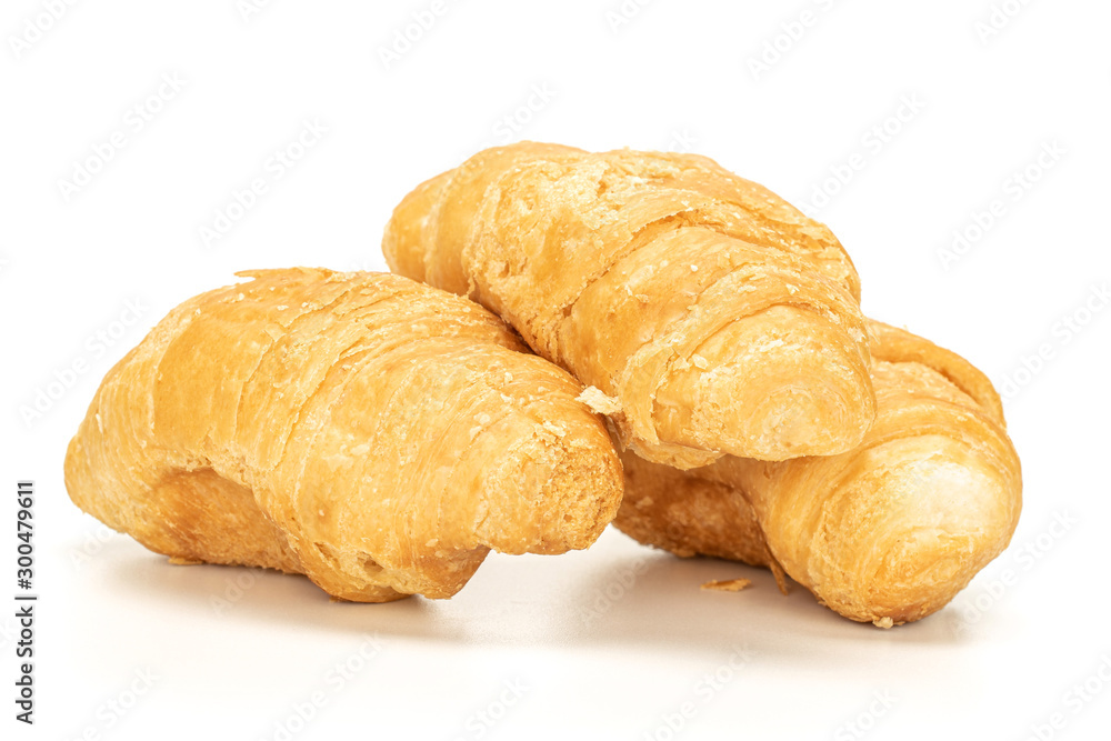 Group of three whole fresh baked mini croissant isolated on white background