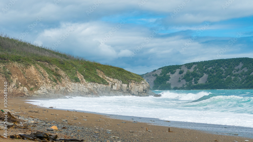 sea shore big waves foam and sun on the background of rocks sea shore big waves foam and sun on the background of rocks