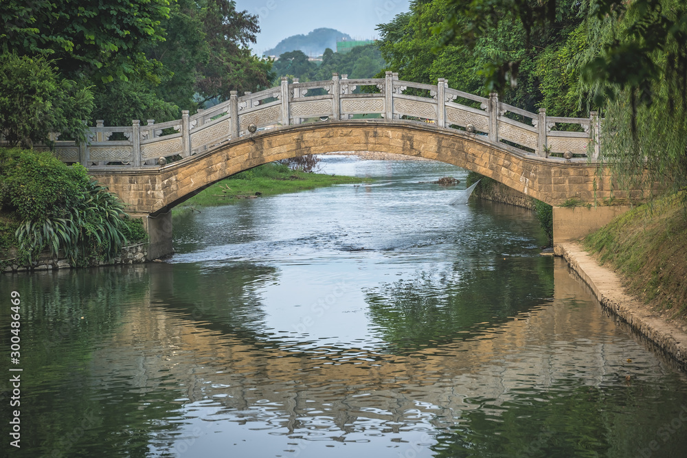 Arched old bridge on Li River in Elephant Trunk Hill Park