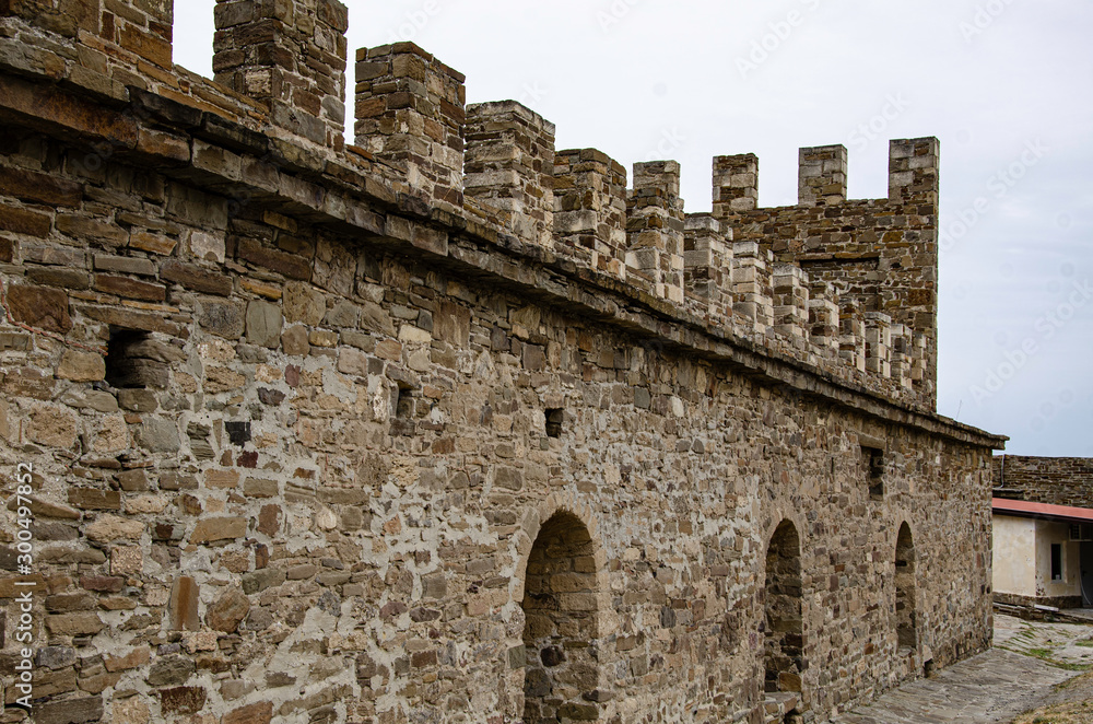 The wall of the old fortress, towers and structures, the ruins of the old fortress.
