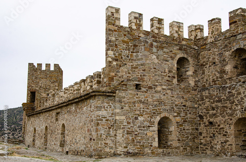 The wall of the old fortress, towers and structures, the ruins of the old fortress.